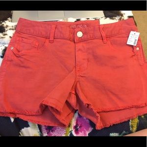 Maurice’s salmon colored shorts